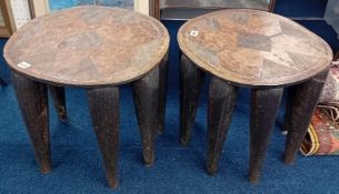An unusual pair of African? 8 legged carved oak tables. Width 43cm, height 52cm.