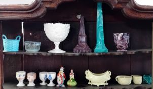 A quantity of various porcelain and decorative objects, to include novelty eggcups, figurines, etc.