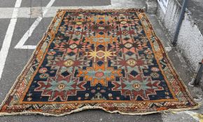 A patterned rug 307cm x 194cm