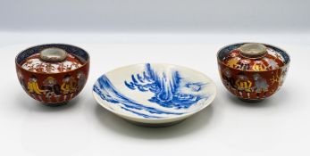 A pair of Japanese 'Nanban Ship' bowls and covers, 19th century, each decorated around the