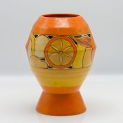 A Clarice Cliff 'Sliced Fruit' pattern vase, height 20cm.