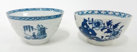 Two 18th century porcelain tea bowls, possibly First Period Worcester, decorated with floral motifs.