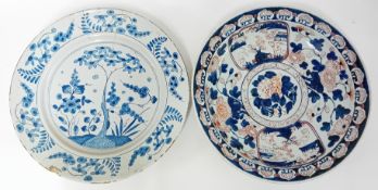 Two large tin-glazed earthenware plates, of floral decoration. (2)
