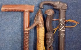 Four carved walking sticks of African style, to include elephant design. (4)