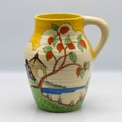 A Clarice Cliff single handled 'Yellow Japan' pattern 'Lotus' shape vase, height approx 19.5cm.