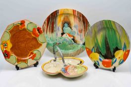 A Clarice Cliff 'Forest Glen' pattern plate, together with another in 'Nasturtium' and 'Delicia