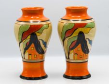A Clarice Cliff pair of vases in 'Orange House' pattern, Fantasque mark to base, height approx 23cm.