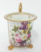 An early 19th century Swansea cabinet cup, of cylindrical form raised on three paw feet, painted