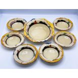 A Clarice Cliff set of bowls in 'Summerhouse' pattern, to include one large bowl and a set of six