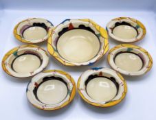 A Clarice Cliff set of bowls in 'Summerhouse' pattern, to include one large bowl and a set of six