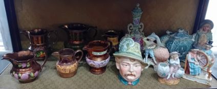 A collection of porcelain figures and lustreware jugs. (13)