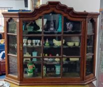 A 19th century Dutch style oak wall cabinet fitted with a single door with an arrangement of 15