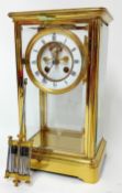 A French brass four glass mantle clock with mercury pendulum.