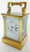 A brass-cased carriage clock, striking on a gong, height 19cm (handle up).