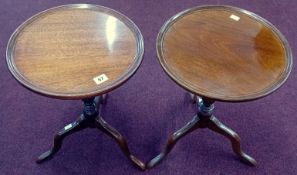 A pair of 20th century mahogany tripod wine tables.