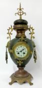 An antique style French simulated sharkskin and brass 8-day pedestal mantel clock.