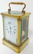 A brass-cased carriage clock, the dial marked DENT, Royal Exchange, Cornhill, London, striking on