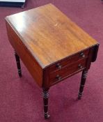 A 19th century mahogany 2-flap work table fitted with two drawers over turned legs.