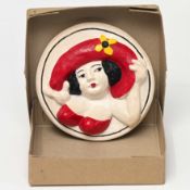 Designed by Beryl Cook O.B.E. (British, 1926-2008) a ceramic circular plaque 'Lady with Red