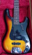 A Squire Precision Bass by Fender, Sunburst, S/N ICS 13098655, cased.