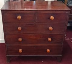 A 19th century mahogany chest of drawers fitted with two short and three long drawers with knob