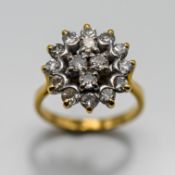 A diamond cluster ring set with sixteen diamonds, shaped into a cross in the middle, set in 18ct
