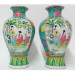 A pair of 19th century porcelain vases, decorated in floral scene in blue ground, height 30cm.