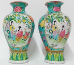 A pair of 19th century porcelain vases, decorated in floral scene in blue ground, height 30cm.