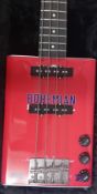 A Bohemian Bass Guitar, made from an oil tin, cased.