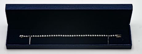 A diamond line bracelet, set in 18ct white gold, set with forty three diamonds, length 18cm,