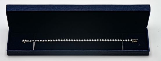 A diamond line bracelet, set in 18ct white gold, set with forty three diamonds, length 18cm,