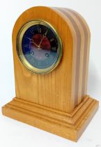 A 20th century wooden mantle clock, gilt and red marble effect Roman dial, height 25cm.