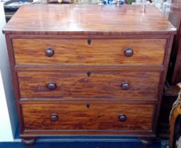 A 19th century mahogany chest of drawers fitted with three deep long drawers with knob handles on