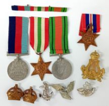 A WWII Trio of medals, to include the George VI Italy Star, The Defence Medal, and War Medal, with