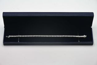 A fine diamond set line bracelet, set in 18ct white gold, with forty nine diamonds, approx 5.64ct,