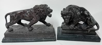 Two large bronze lions on plinths, one signed to base 'BARYE', max height approx 24cm.