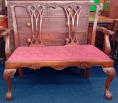 A modern George III Chippendale style double seat, carved pierced splats, upholstered red seat on