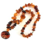 An amber necklace set with chunky beads, approx 117.2g.