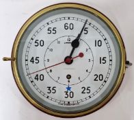 A brass cased ships clock, Arabic enamel dial, mounted on wood.