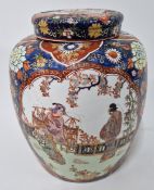 A large Chinese vase and cover, of floral decoration on a red ground, height 31cm.