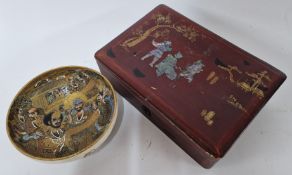A Chinese ceramic gilt bowl, decorated with figures in elaborate dress, textured dragon to the