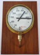 A modern ships combined pressure and vacuum meter, AP. 942-0766 PH. Bronze Tube, brass cased mounted