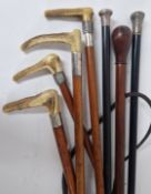 A collection of Victorian walking sticks and riding crops, silver mounted, some with antler