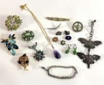 A collection of costume jewellery of mainly brooches including a pair of silver buckles possibly