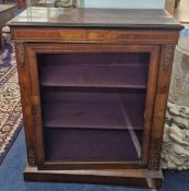 A glass front pier cabinet, with brass floral fittings, height approx 101cm, width approx 83cm.