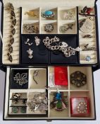 A collection of costume jewellery to include brooches, rings, silver bracelet with heart padlock