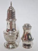 A silver sugar caster, with finial, hallmarked Birmingham 1933, together with a silver pepper shaker