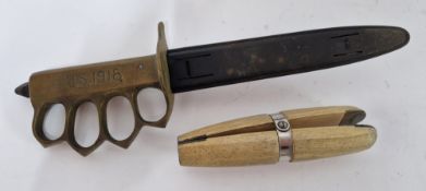 A 1918 US pattern trench knife, brass hilt with finger hole grip, scabbard marked L.F.&C. 1918,