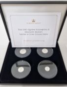 An Elizabeth II set of four silver Maundy money coins, to include one penny, two pence, three pence,