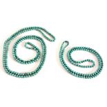 Two sets of turquoise coloured bead necklaces.